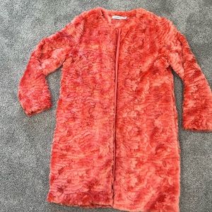 Long thigh length fur trench jacket